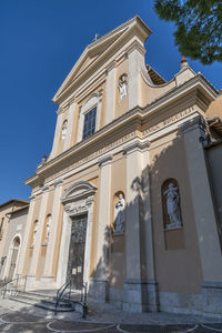 Low angle view of building against blue sky