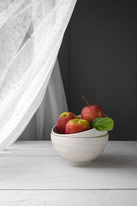 High angle view of fruits on table at window sill