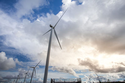 Low angle view of wind turbine against sky