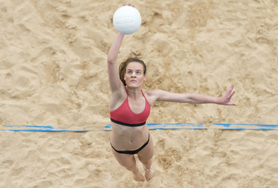 Full length of woman standing on beach