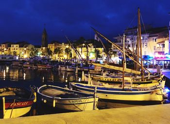 Boats moored at harbor