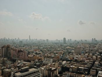 High angle view of buildings in city against sky