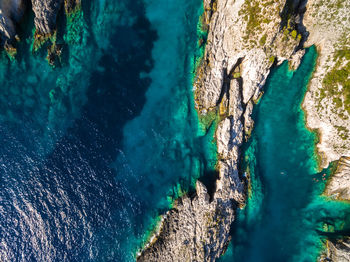 High angle view of rock formation in sea