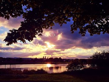 Scenic view of lake against cloudy sky