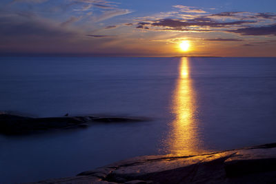 Scenic view of sunset over sea