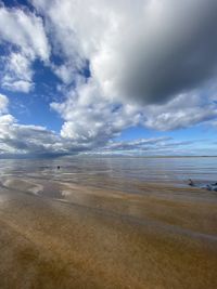 Scenic view of beach against sky