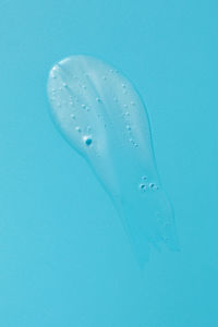 Low section of person swimming in water