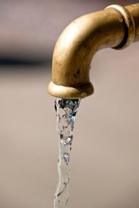 Close-up of water flowing from faucet