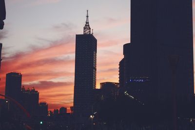 View of skyscrapers at sunset