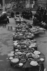 People at market stall in city