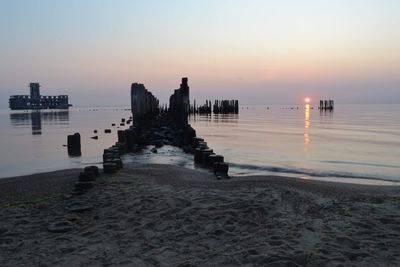 Scenic view of sea against clear sky during sunset