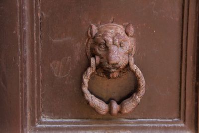 Close-up of animal sculpture on door