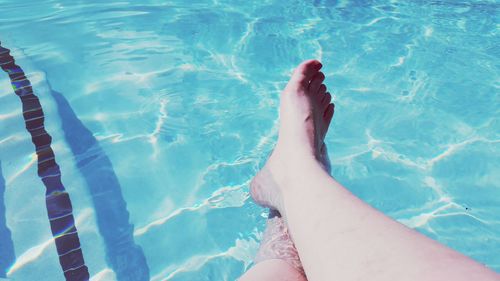 Low section of woman in swimming pool