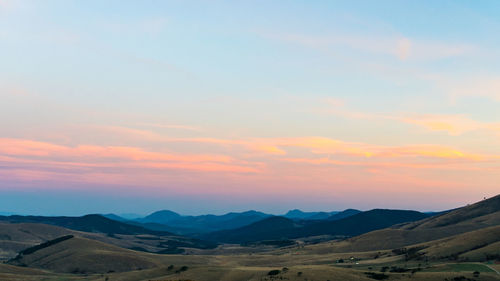 Scenic view of mountains against sky during sunset