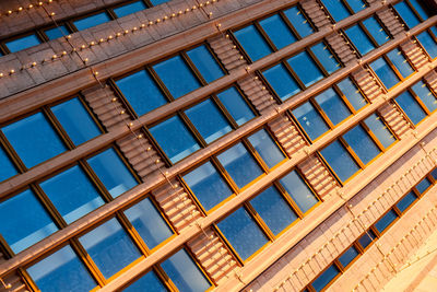 Modern office building, detailed view of finance house windows. pattern. office building, blue glass