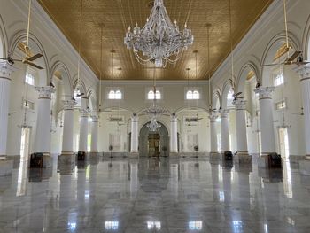 Low angle view of illuminated chandelier in building