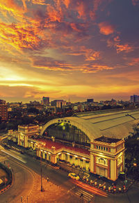 High angle view of bridge and buildings against sky during sunset