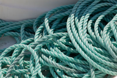 High angle view of turquoise ropes at harbor