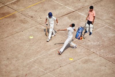 High angle view of boys playing on the ground