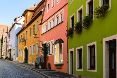 Residential buildings by street in city