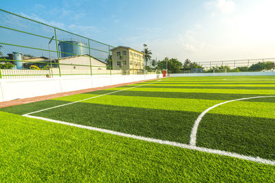 Scenic view of soccer field against sky