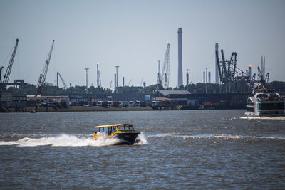 Nautical vessel on sea against clear sky