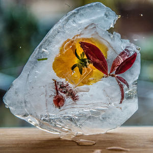 Close-up of ice cream on glass table