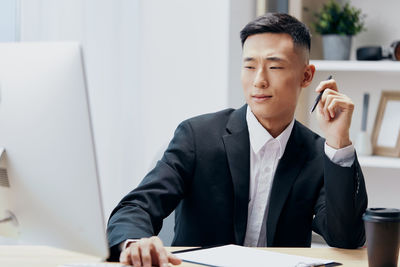 Businesswoman working at desk in office