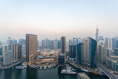 Panoramic view of buildings in city against sky