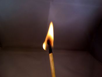 Close-up of lit match