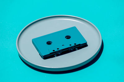 High angle view of usb cable on blue background