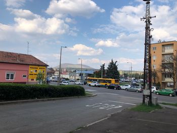 City street and buildings against sky