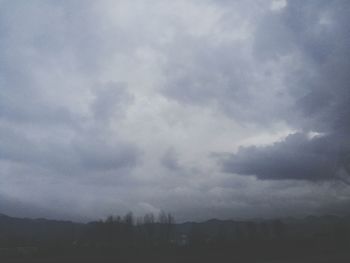 Scenic view of landscape against cloudy sky