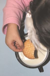 Midsection of woman holding ice cream in plate