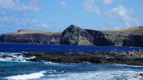 Scenic view of sea against cloudy sky