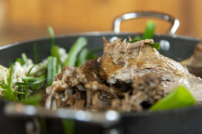 Close-up of duck meal served in bowl