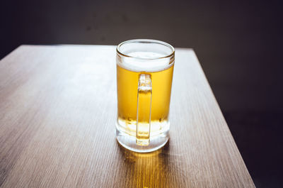 Close-up of beer glass on table