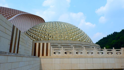 Low angle view of modern building against sky