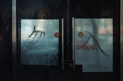 Close-up of closed glass door