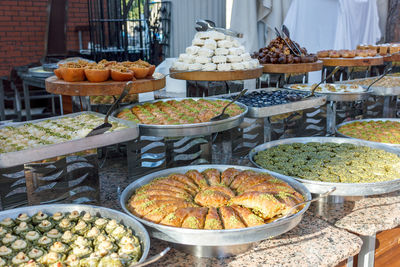Traditional turkish desserts baklava and lokum in open buffet restaurant at hotel 