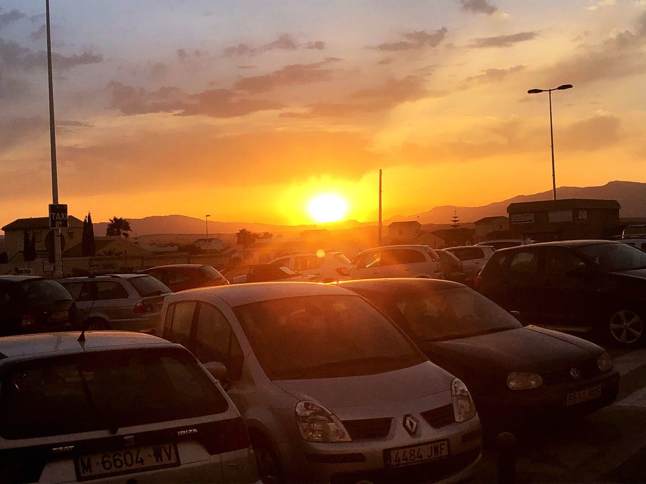 CARS ON STREET DURING SUNSET