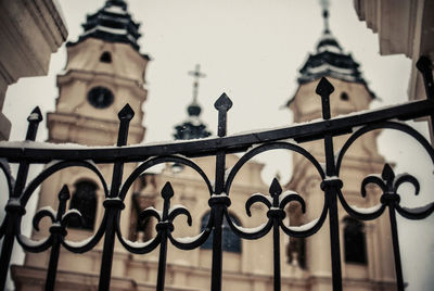 Close-up of gate against building