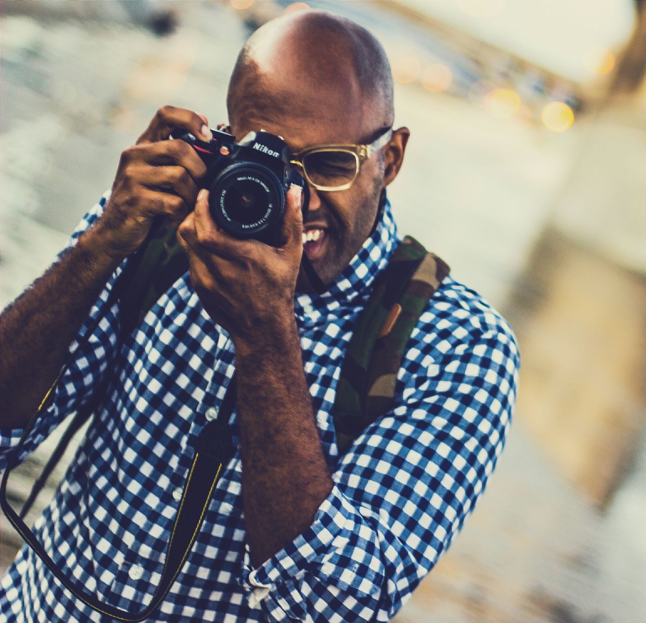 lifestyles, leisure activity, focus on foreground, men, holding, casual clothing, young adult, looking at camera, portrait, front view, sunglasses, standing, day, person, close-up, sitting, photography themes, outdoors