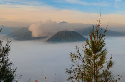 Scenic view of mountain against cloudy sky