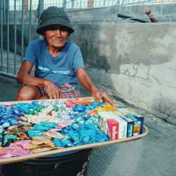 Portrait of a man sitting outdoors