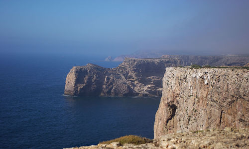 A cliff surrounded by waterscape, algarve, saint vincent's cape