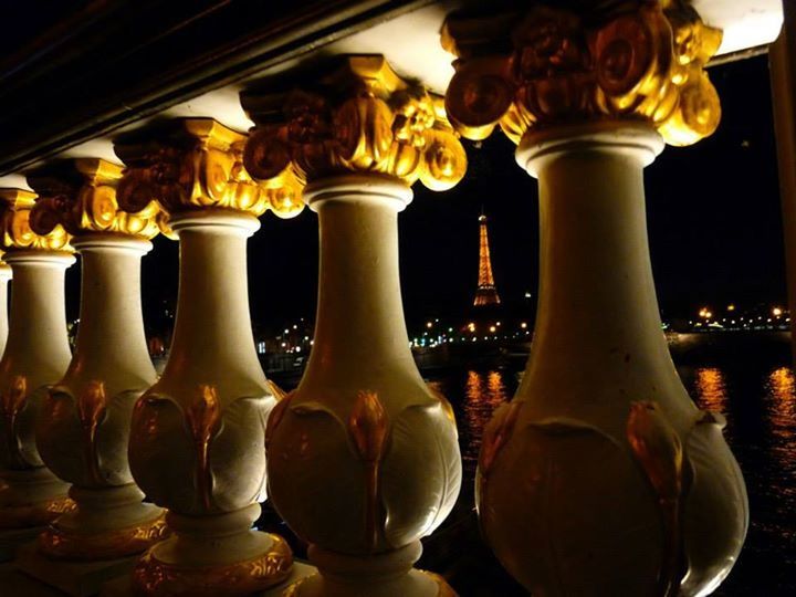 indoors, illuminated, in a row, art and craft, ornate, sculpture, close-up, statue, art, gold colored, night, still life, no people, religion, decoration, human representation, architectural column, creativity, candle