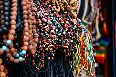 Close-up of decorations hanging in market stall for sale