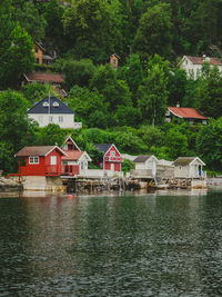 Small colorful fish boat houses in oslo fjord in norway. oslo fjord shore and scandic wooden houses