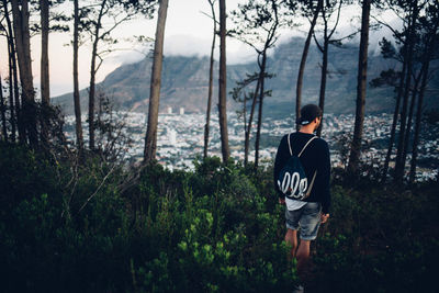 Young man looking at forest